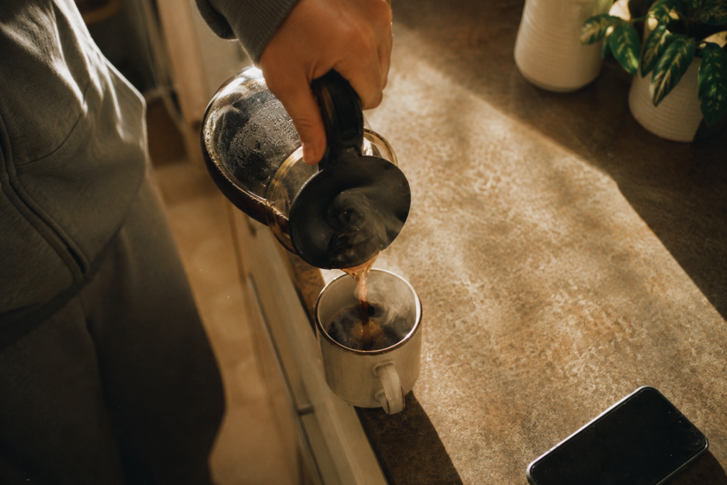 Pouring the first coffee — the everyday cue a short meditation can be anchored to so it actually sticks